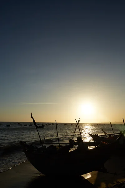 Fishing boats at sunset