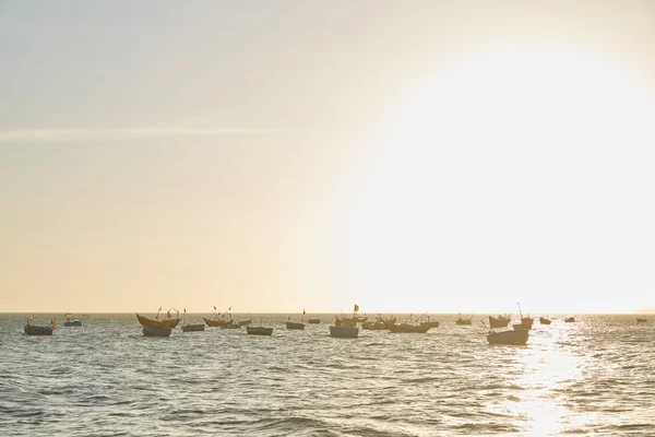 Fishing boats at sunset