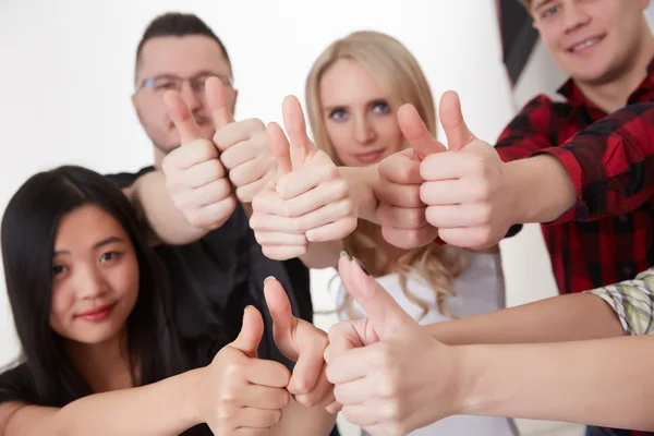 Students showing thumbs up