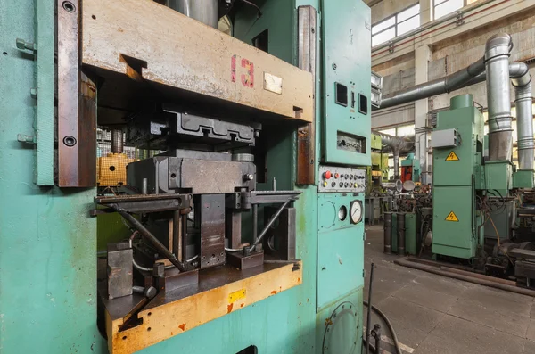 Hydraulic press close-up. Machinery plant.