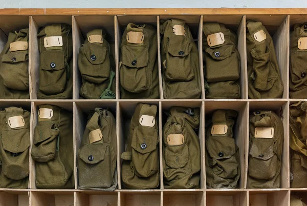 Bags of gas mask in wooden rack