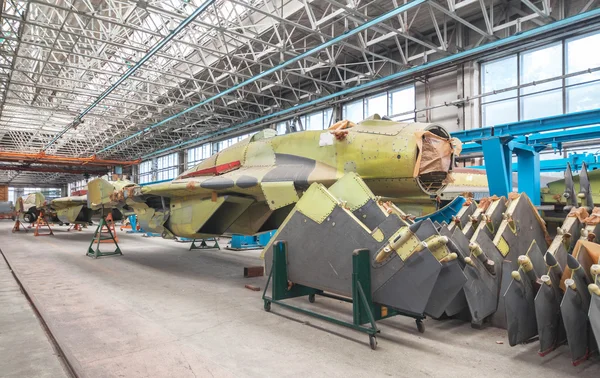 Aviation factory of military aircraft. Assembly of the Russian fighter. Focus on the cockpit