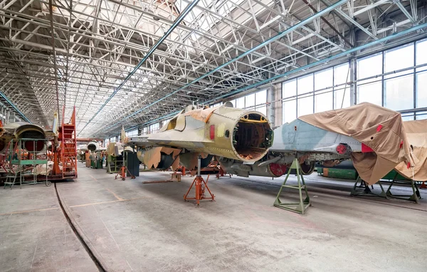 Aviation factory of military aircraft. Assembly of the Russian fighter. Focus on the cockpit