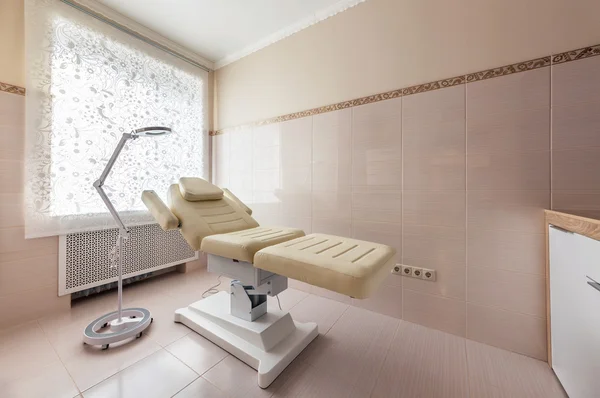 The treatment room in beauty salon. The chair for procedures