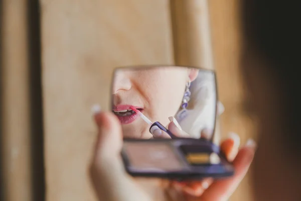 Gorgeous beautiful bride with green eyes mirror reflection face closeup