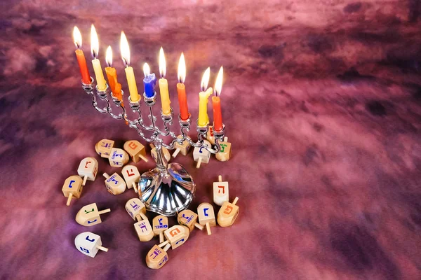 Jewish holiday Hanukkah creative background with menorah. View from above focus on .
