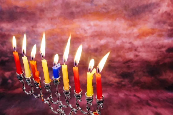 Jewish holiday Hanukkah creative background with menorah. View from above focus on .