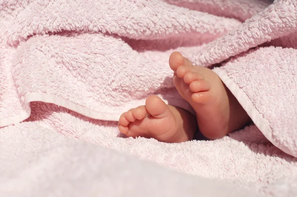 Baby Feet under blanket