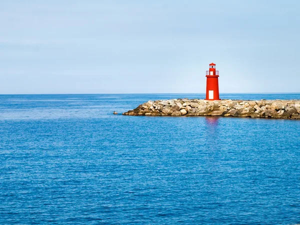 Red lighthouse at the port of entry reporting