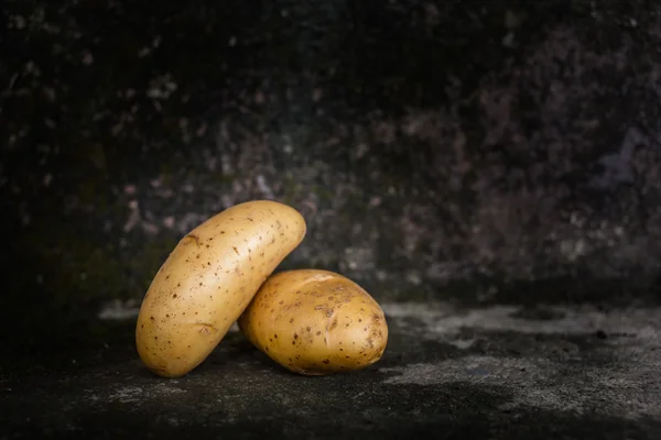 Two raw Potatoes