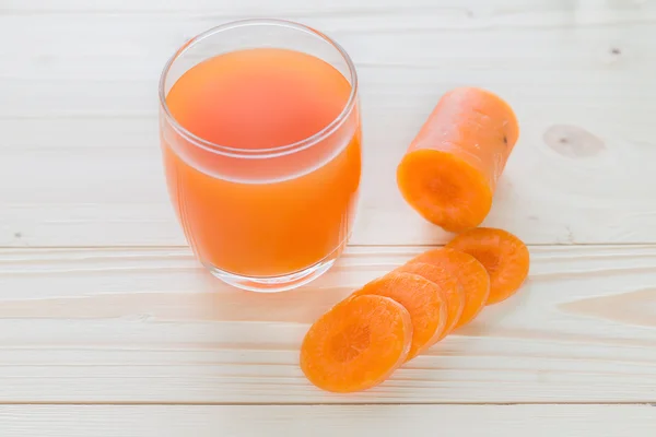 Carrot juice and slices of carrot