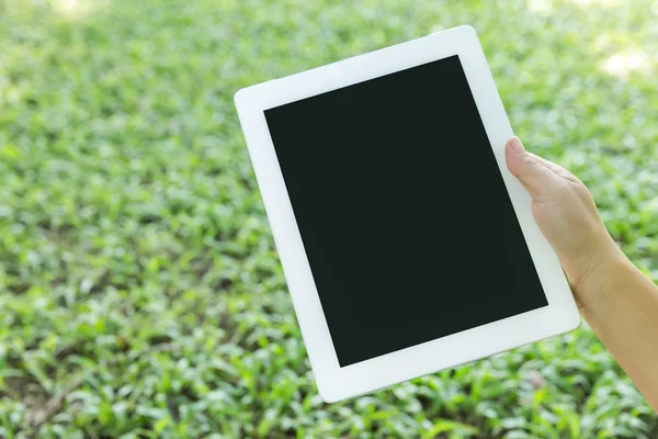 Hand holding a modern tablet