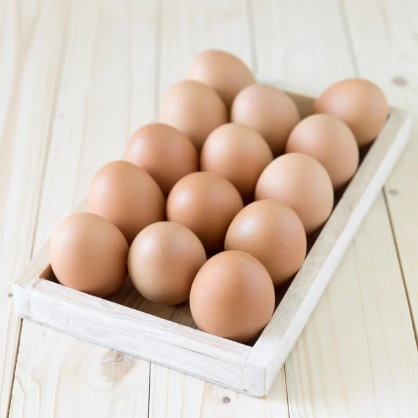 Chicken eggs in wood box