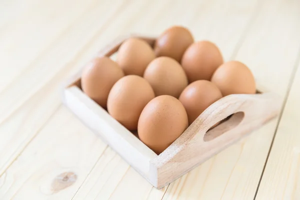 Chicken egg in wood box