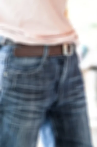 Female butt in jeans-blurred background