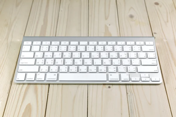 Typical Mac Keyboard on wood table