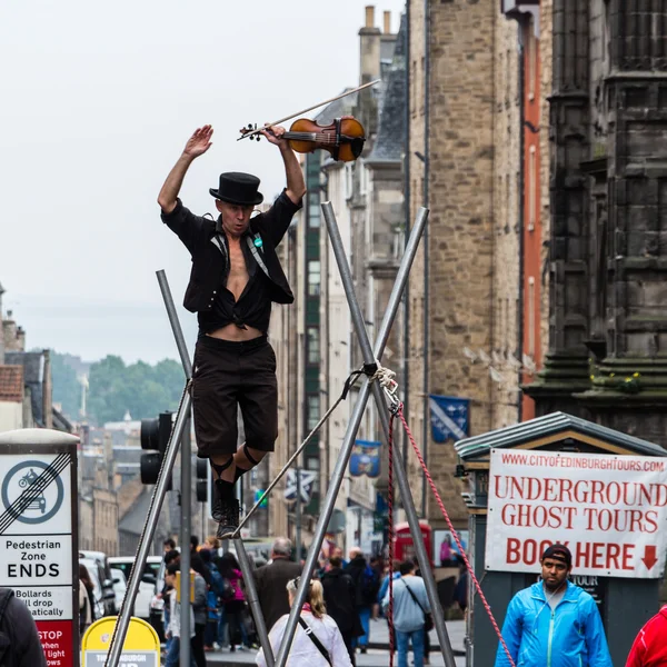 Street performer on the rope