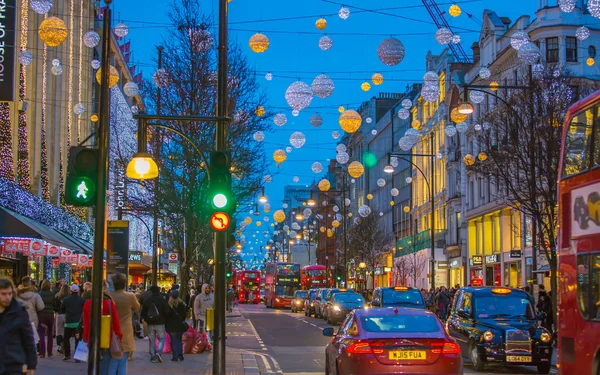 Christmas lights decoration at Oxford street and lots of people walking during the Christmas sale, London