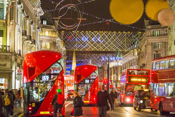 Christmas lights decoration at Oxford street and lots of people walking during the Christmas sale, London