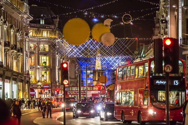 Christmas lights decoration at Oxford street and lots of people walking during the Christmas sale, London