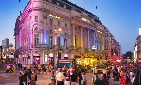 LONDON, UK - AUGUST 22, 2014: Piccadilly Circus in night. Famous place for romantic dates. Square was built in 1819 to join of Regent Street