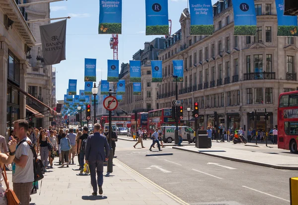 LONDON, UK - JULY 29, 2014: Regent street in London, tourists and busses