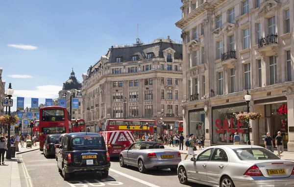 LONDON, UK - JULY 29, 2014: Regent street in London, tourists and buses