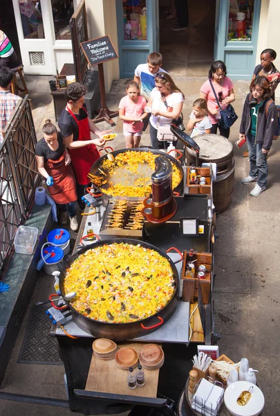 Paella in Covent Garden market, one of the main tourist attractions in London, known as restaurants, pubs, market stalls, shops and public entertaining.