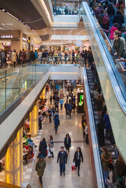 LONDON, UK - NOVEMBER 29, 2014:  Westfield Stratford City Shopping centre  with lots of people rushing for Christmas sale.