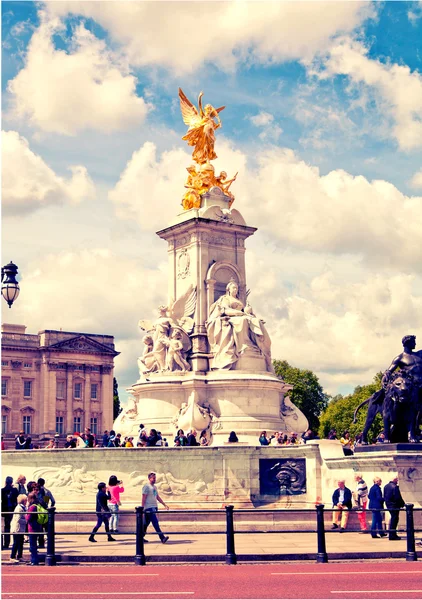 LONDON, UK - MAY 14, 2014: The Victoria Memorial is a sculpture dedicated to Queen Victoria, created by Sir Thomas Brock. Placed at the centre of Queen\'s Gardens in front of Buckingham Palace.