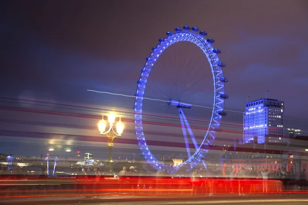 London eye in the night and south bank of river Thames, famous London's walk and tourist destination