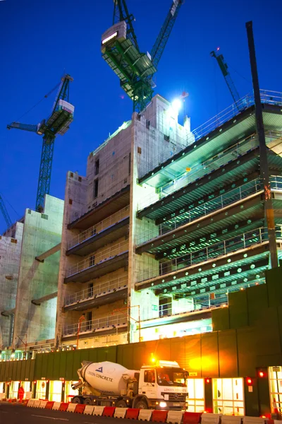 LONDON, UK - DECEMBER 19, 2014: Building site with cranes in the City of London business. New development next to bank of England. Night view