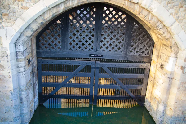 LONDON, UK - APRIL15, 2015: Tower of London started 1078, old fortress, castle, prison and house of Crown Jewels. Traitors gate entrance. View form the river side park