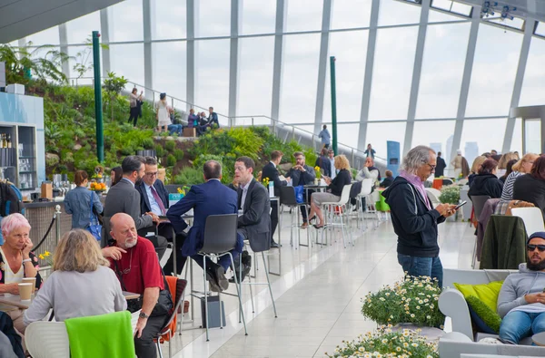 LONDON, UK - APRIL 22, 2015: People in the restaurant of the Sky Garden Walkie-Talkie building. Viewing platform is heist UK garden, locates at the 32 floor and offers amazing skyline of London city.