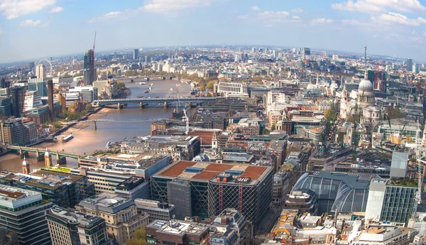 LONDON, UK - APRIL 22, 2015: City of London panorama includes river Thames, bridges, London eye and St. Paul\'s cathedral