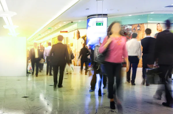 LONDON, UK - MARCH 31, 2015: Business people moving blur. People walking in rush hour. Business and modern life concept