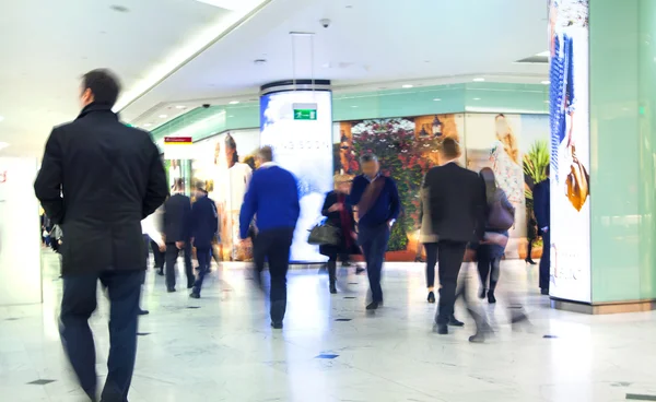 LONDON, UK - MARCH 31, 2015: Business people moving blur. People walking in rush hour. Business and modern life concept