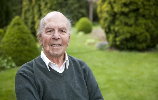 Portrait of 95 years old english man in his garden