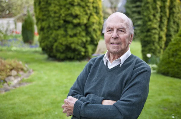 Portrait of 95 years old english man in his garden