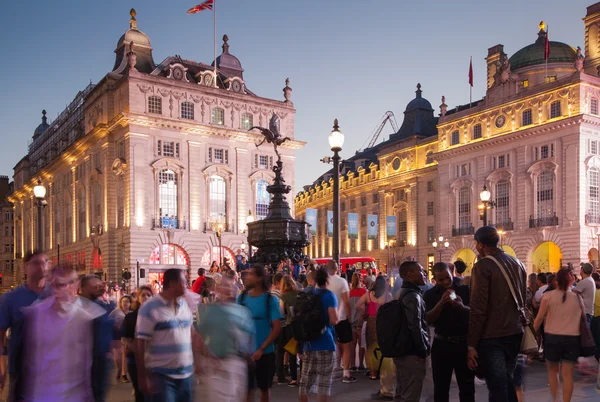 LONDON, UK - AUGUST 22, 2015: Piccadilly Circus in night. Famous place for romantic dates. Square was built in 1819 to join of Regent Street