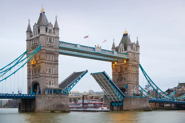LONDON, UK - APRIL 15, 2015: City of London panorama at sunset. Tower bridge and River Thames