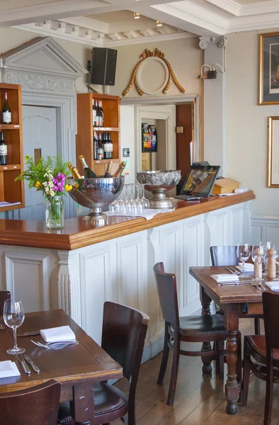 LONDON, UK - APRIL 14, 2015: Old English victorian public house interior. Early morning settings with no people