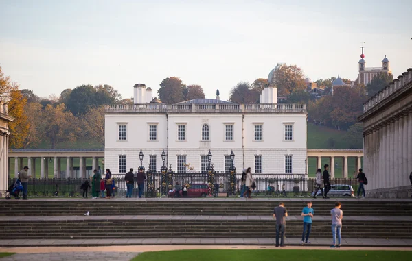 London, Queen\'s palace. Classic English architecture. View includes University of Greenwich building and people walking by