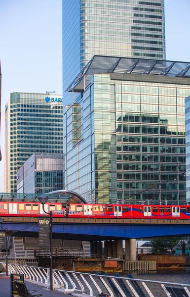 LONDON, UK - SEPTEMBER 9, 2015: DLR train running through the Canary Wharf business and banking aria