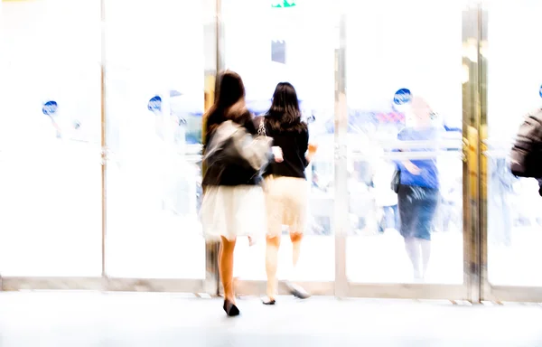 London, People blur background. People walking in the hall of office building