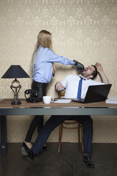 Businessman gets a punch in the face from his employer