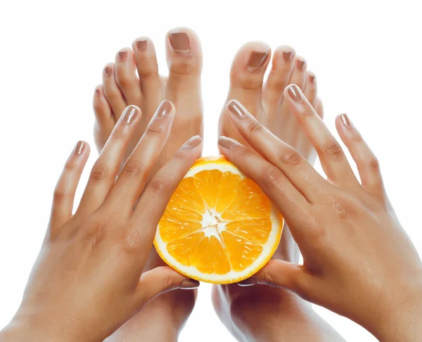 Hands holding orange