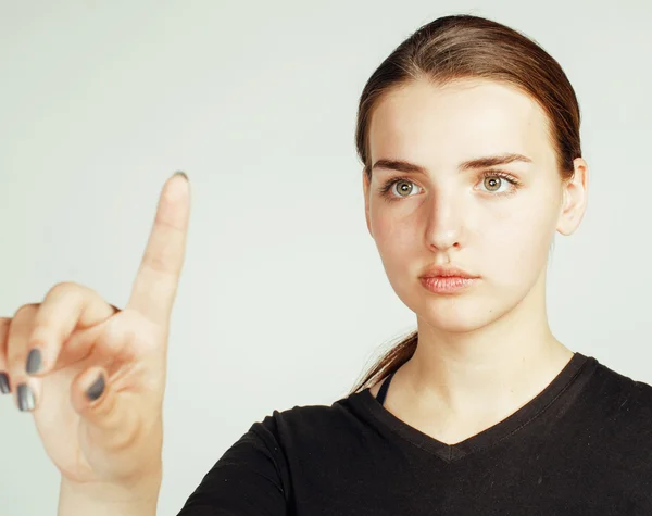 Young pretty girl pointing on white background, business science people concept