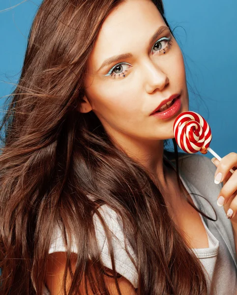 Young pretty adorable woman with candy close up like doll