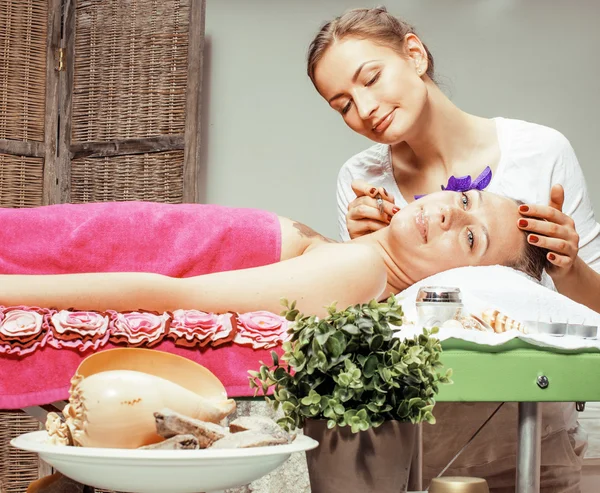 Stock photo attractive lady getting spa treatment in salon, massage doctor smiling care pretty